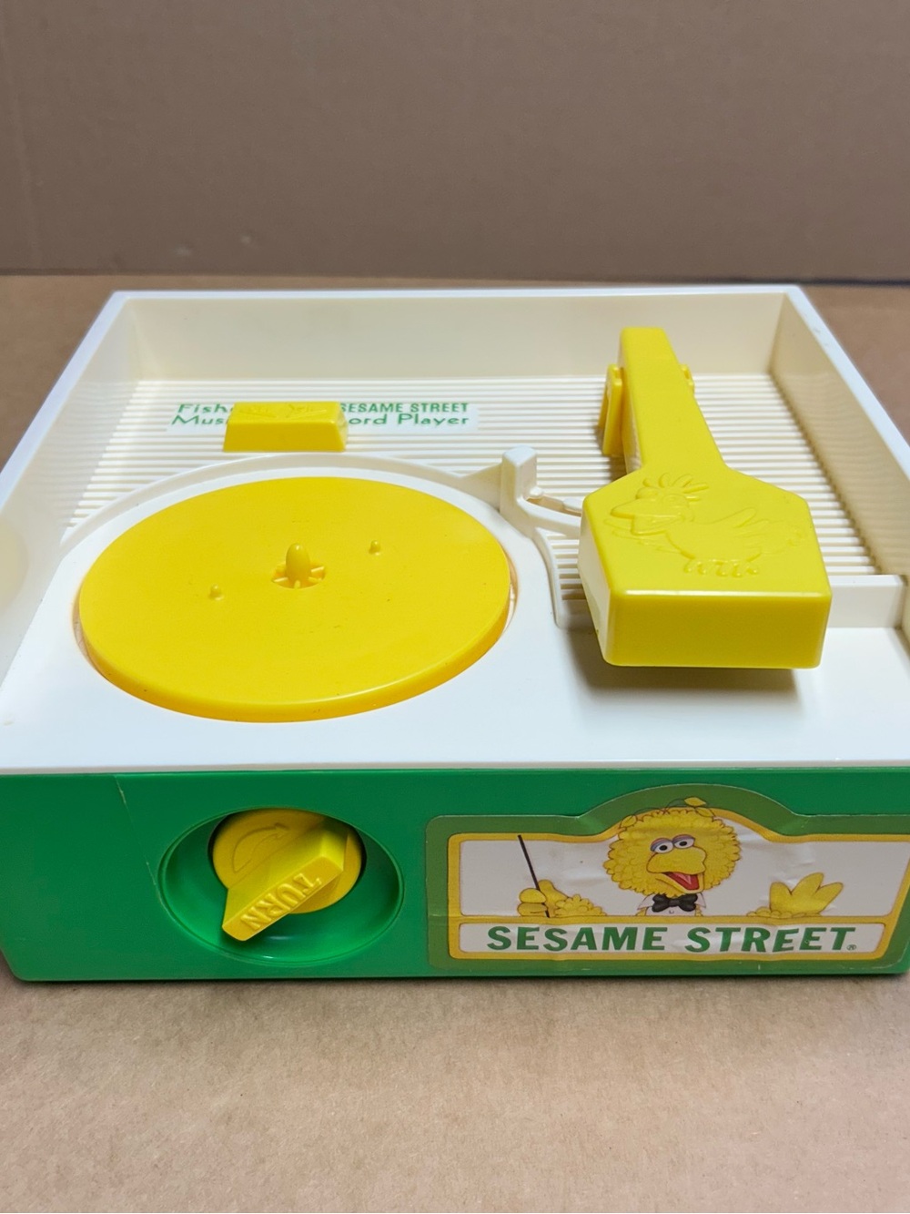 Vintage Sesame Street Yellow Turntable Toy with Green Base